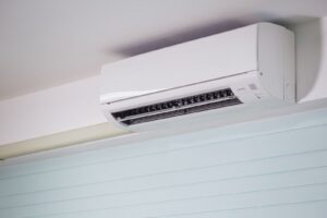 Wall-mounted ductless mini split heat pump indoor unit in a home