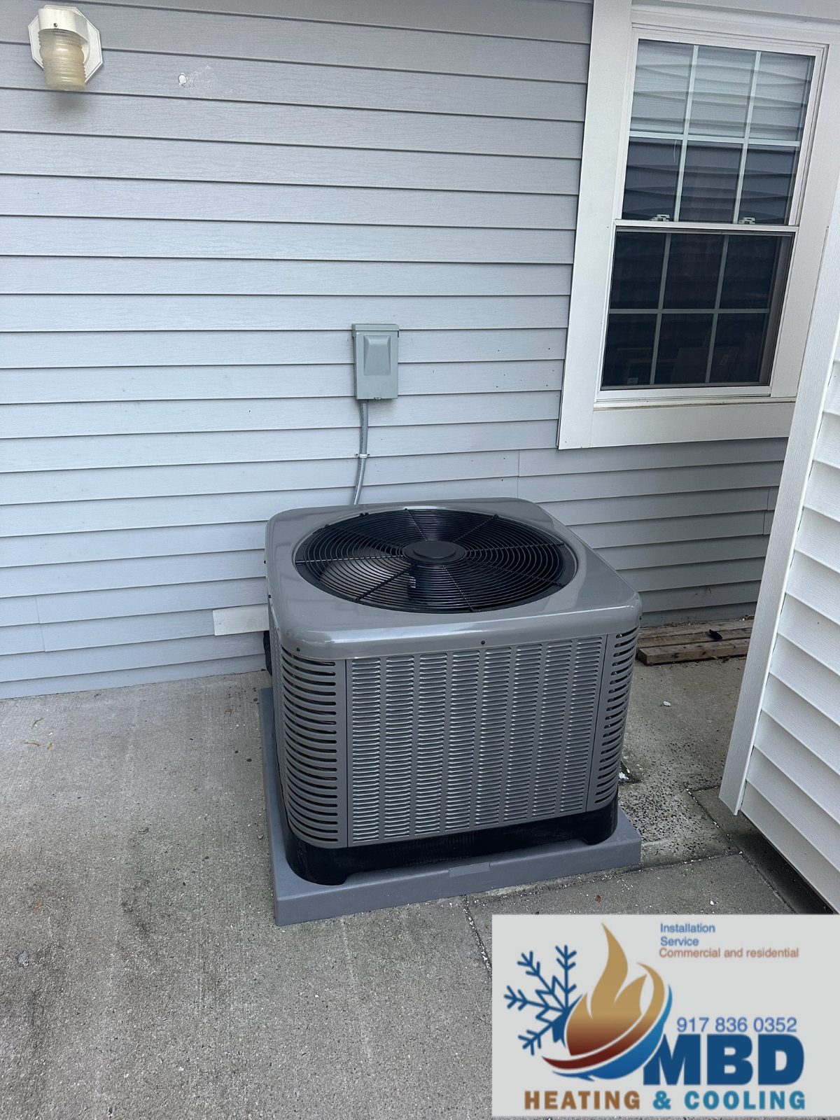 Outdoor condenser beside a house