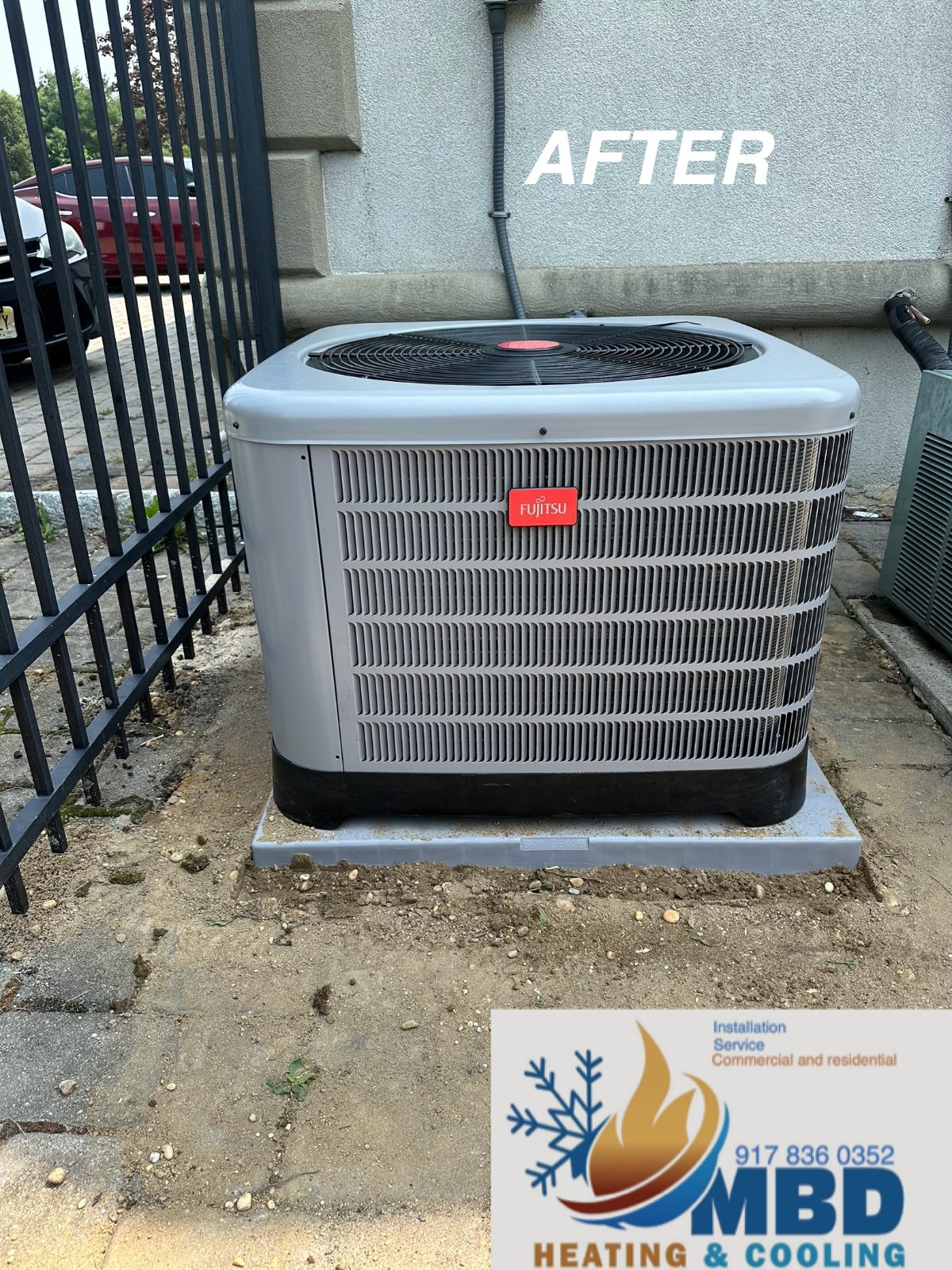 New outdoor condenser behind a side gate after replacement