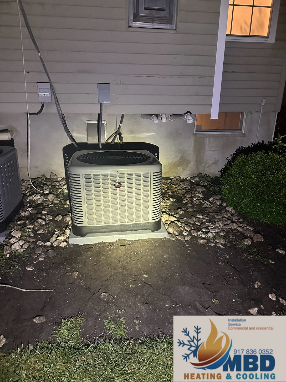 Outdoor condenser beside a house