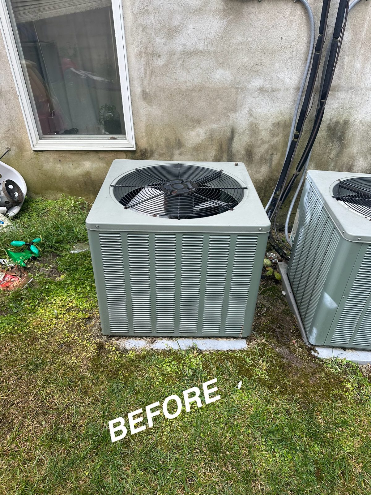 Two old outdoor condensers before replacement