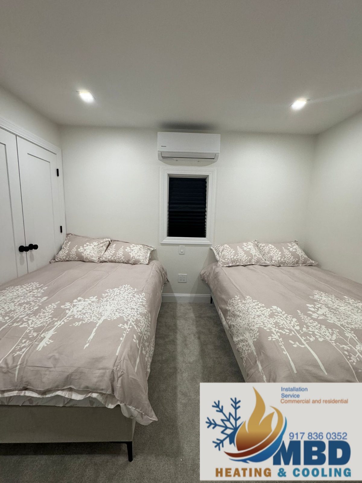Wall-mounted ductless mini split in an empty bedroom